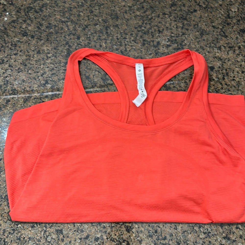 Lululemon swiftly tech razorback tank top size 16 red orange tank top